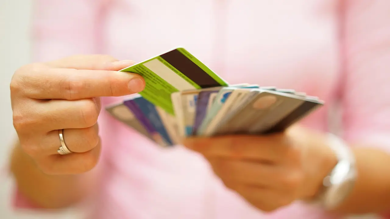 woman choose one credit card from many, concept of credit card debt