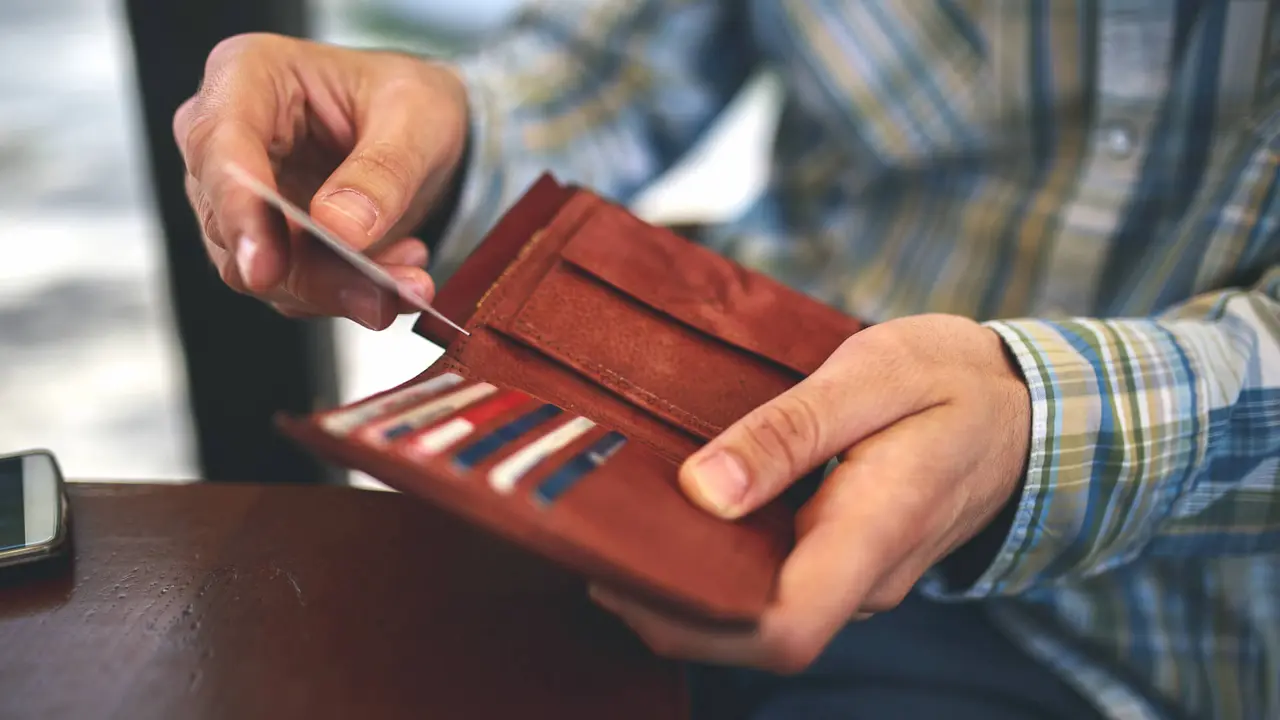 Man buys with a credit card.