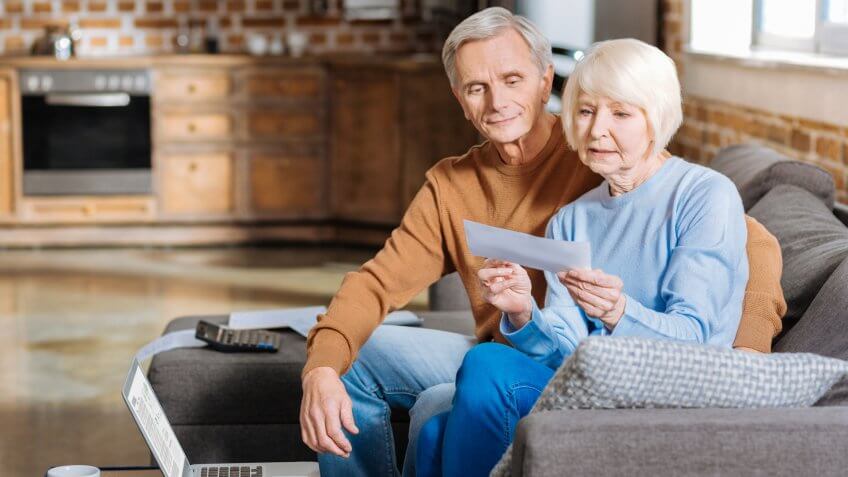 elderly couple receiving social security check