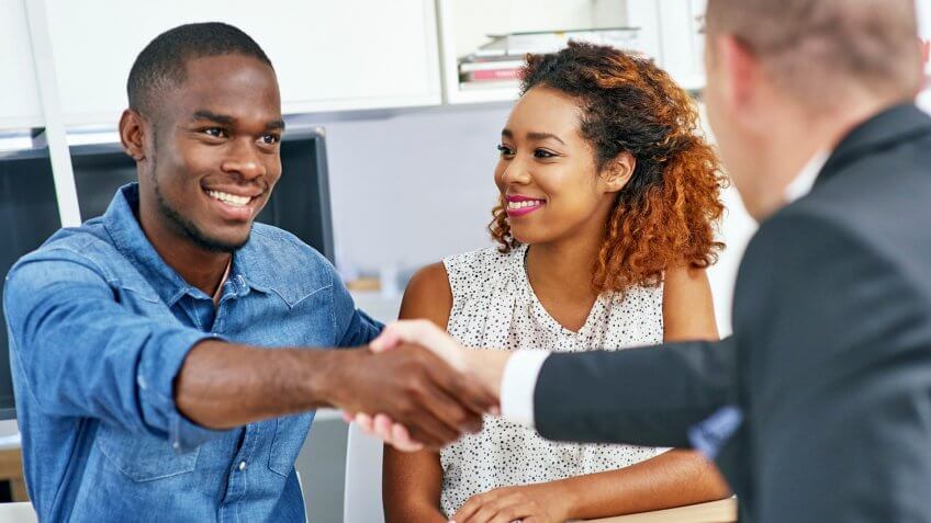 Shot of a young couple consulting a financial advisorhttp://195.