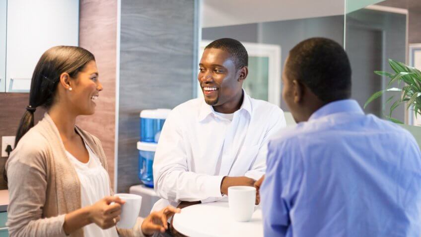 business colleagues having coffee together on their tea break