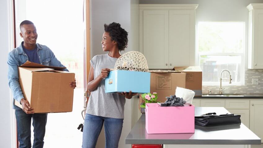Young Couple Moving In To New Home Together.