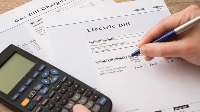 Electric bill charges paper form on the table.