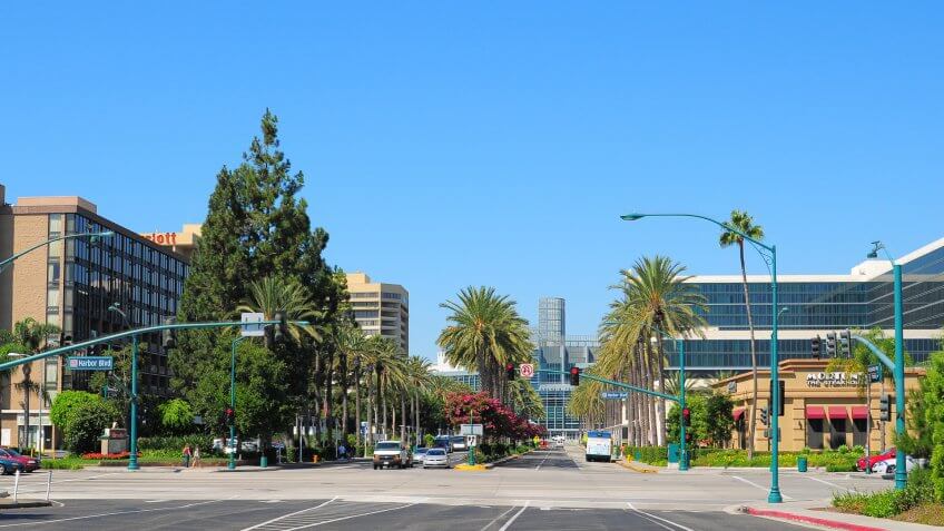 Anaheim, United States - September 8, 2011: A street scene of Anaheim's Convention Center area, which has hotels like a Hilton Hotel (on the right side) as well as the Anaheim Convention center down the end of Convention Way.