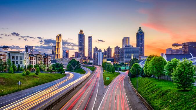 Atlanta, Georgia, USA downtown city skyline over Freedom Parkway.