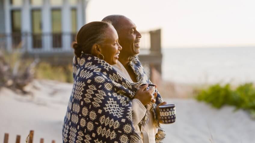 60-65 years, 65-70 years, Beach, Blanket, Boyfriend, Coffee, Color Image, Copy Space, Couple, Family, Food And Drink, Girlfriend, House, Husband, Laughing, Leisure Activity, Love, Mug, Outdoors, Photography, Relaxation, Senior Adult, Side View, Smiling, Standing, Sunrise, Sunset, Travel, Two People, Waist Up, Weekend Activities, Wife, anniversary, babyboomer, cuddling, enjoying, friend, happy, man, men and women, nature, ocean, people, profile, recreation, resort, retirement, romance, together, vacation, woman