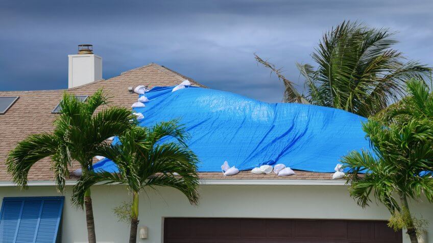 storm-damaged-roof-on-house-protective