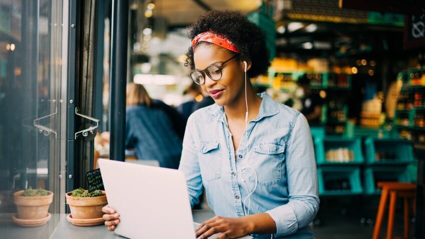 focused-young-african-woman-sitting-alone