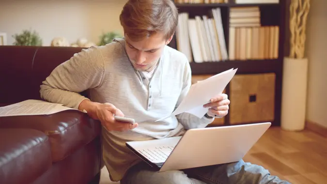 attractive young man in home interior.