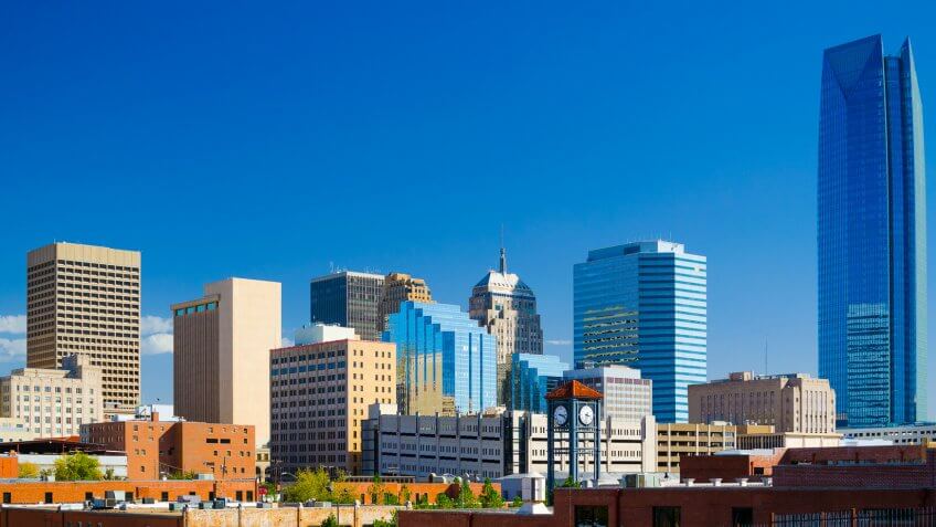 Oklahoma downtown skyline with a deep blue sky, featuring the new Devon Energy Center building.