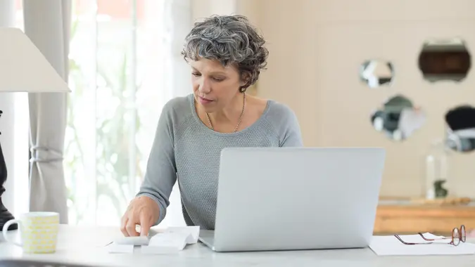 Senior woman working on home finance.