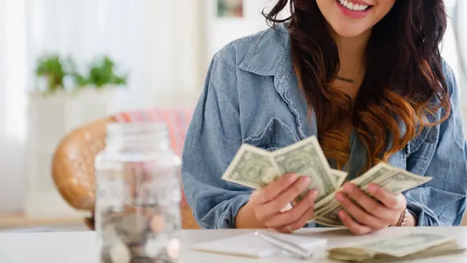 young woman counting cash