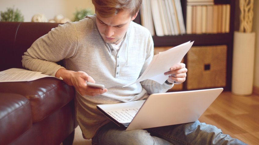 attractive young man in home interior.