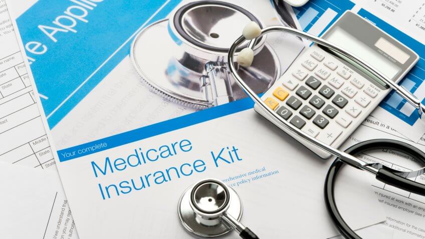 Medicare brochure with paperwork.