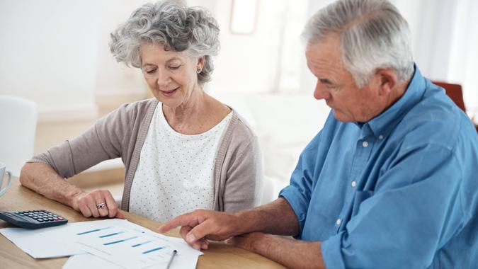 Cropped shot of a senior couple reviewing their financial investmentshttp://195.