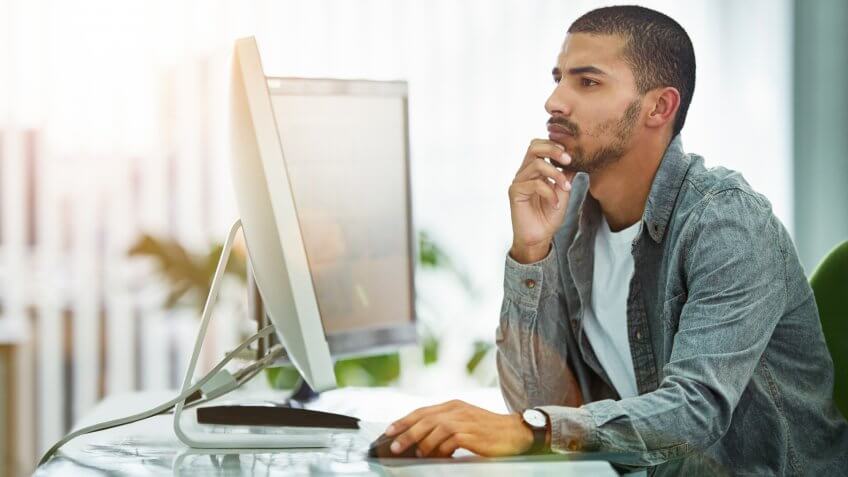 Shot of a young designer working at his computer in an officehttp://195.