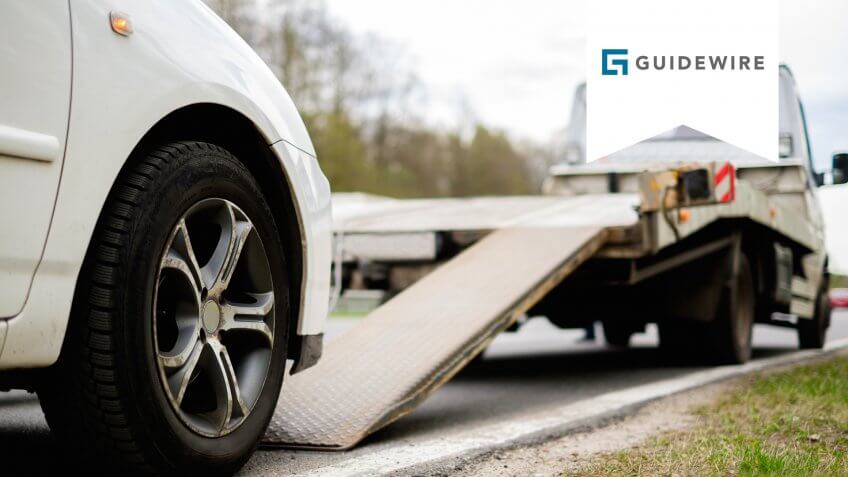 loading-broken-car-on-tow-truck