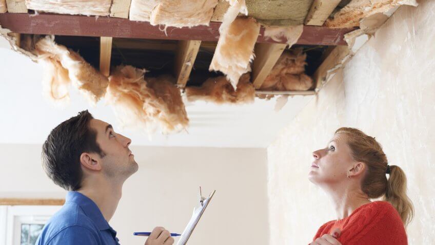 builder-client-inspecting-roof-damage