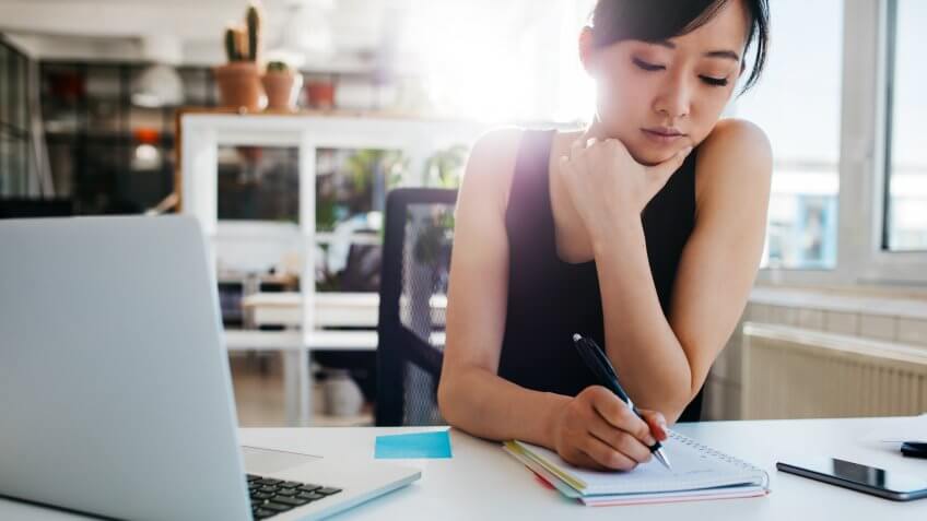 asian-businesswoman-writing-notes