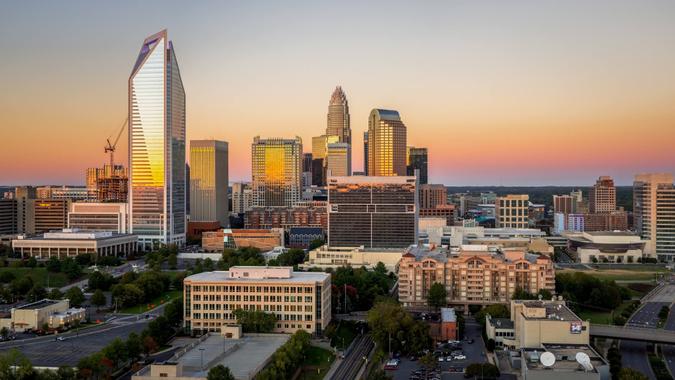 The Charlotte, North Carolina skyline seen during sunset on a colorful clear afternoon.