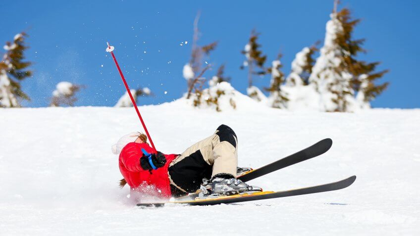 girl-skier-falling-down-white