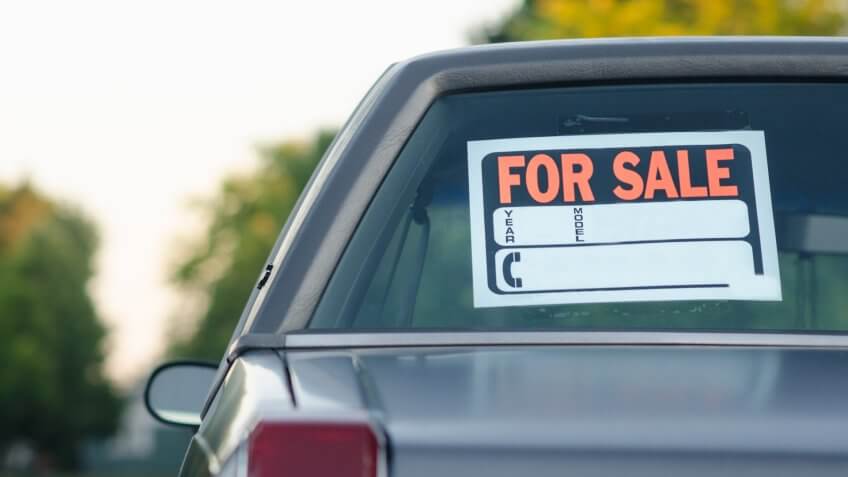 Parked vehicle for sale on a street, with space for own text.
