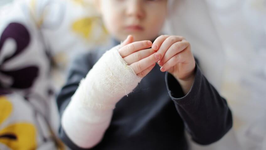 little-baby-girl-showing-her-bandaged