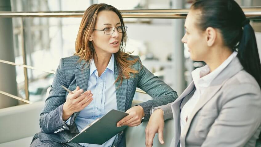 Hr manager asking questions to female candidate.