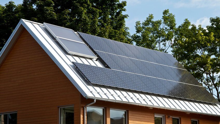 Green house with solar panels, Portland, Maine.