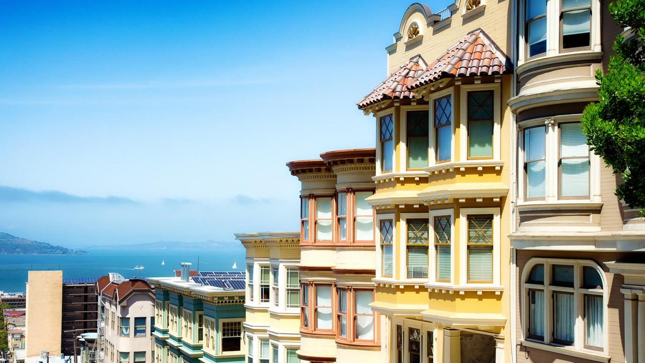 Colorful San Francisco building tops with Bay on a Sunny day.