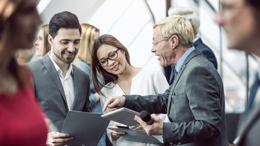 Business People on a Conference Event Discussing.