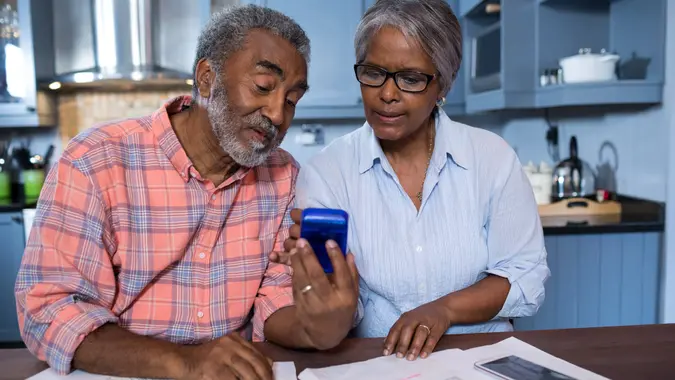 retired-african-american-married-couple-discussing-taxes