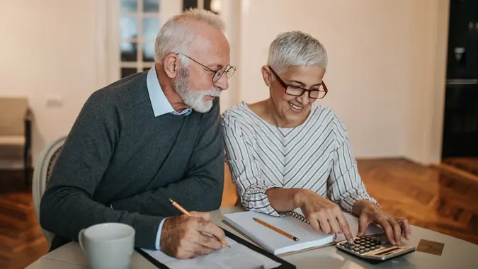 senior couple calculating their finances