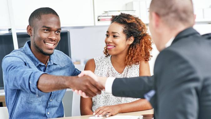 Shot of a young couple consulting a financial advisorhttp://195.