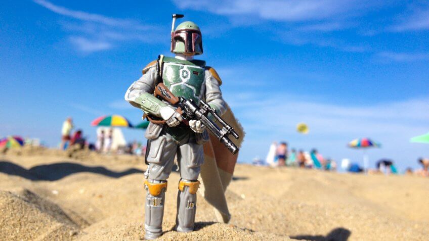 AVON, NEW JERSEY: AUGUST 15, 2013: Star Wars figure of Boba Fett on a beach.