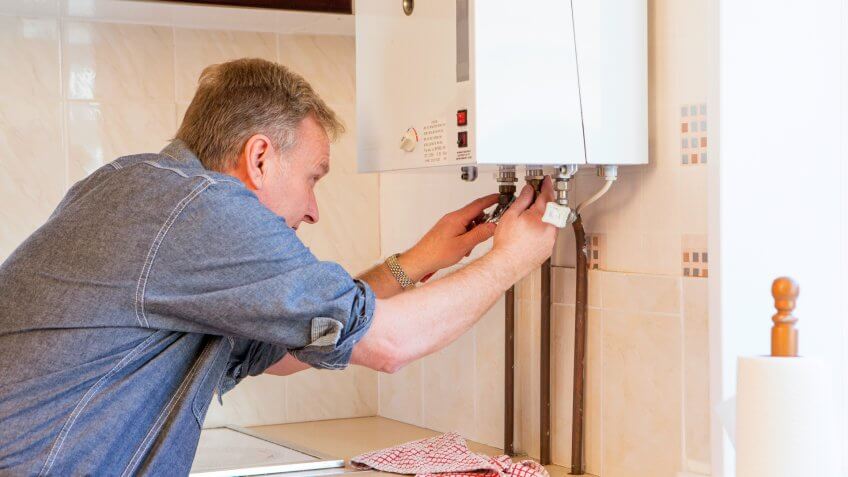 Man Fixing his Boiler