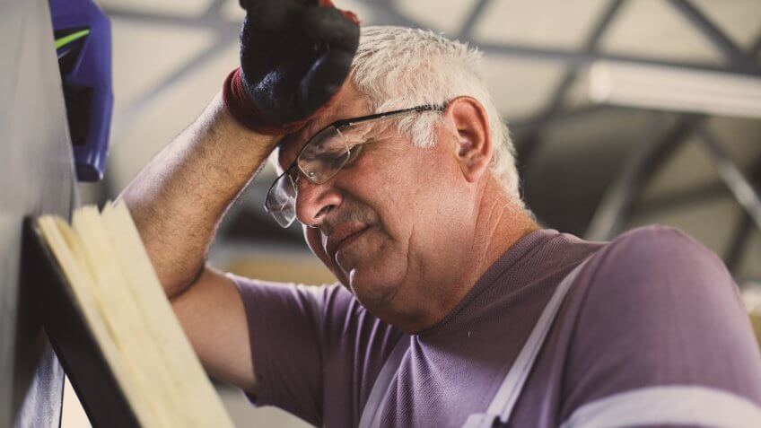 Senior man in workshop.