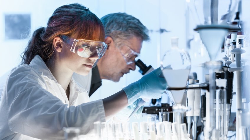 Health care researchers working in life science laboratory.