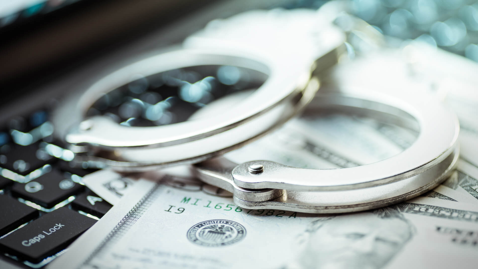 Internet crimes and handcuffs.