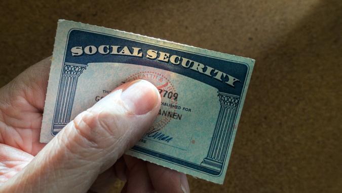 man holding social security card.