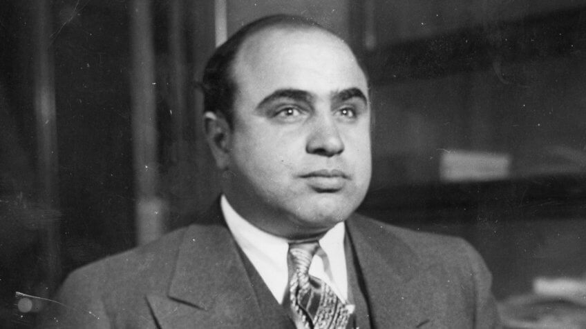 Scarface" Al Capone is shown here at the Chicago Detective bureau following his arrest on a vagrancy charge as Public Enemy No.