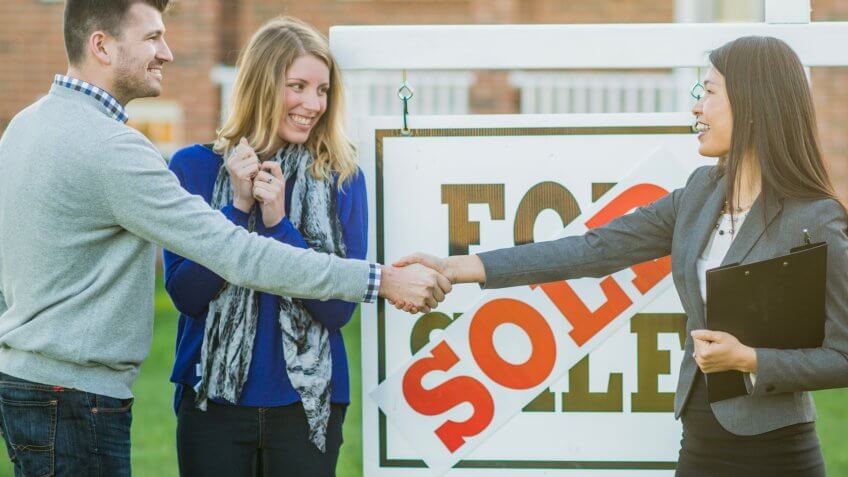 A Caucasian heterosexual couple have just purchased a new house.