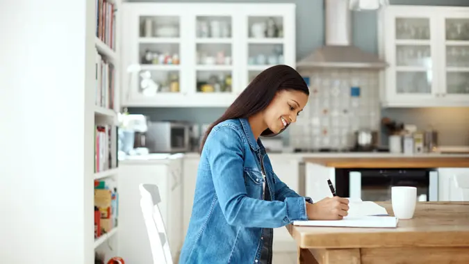 woman going through her paperwork at home