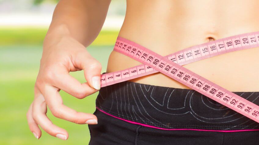waist with a tape measure