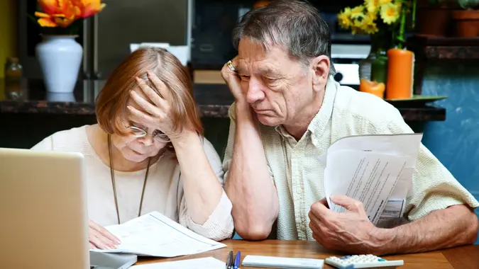 debt, elderly couple, financial struggle, paying bills, seniors