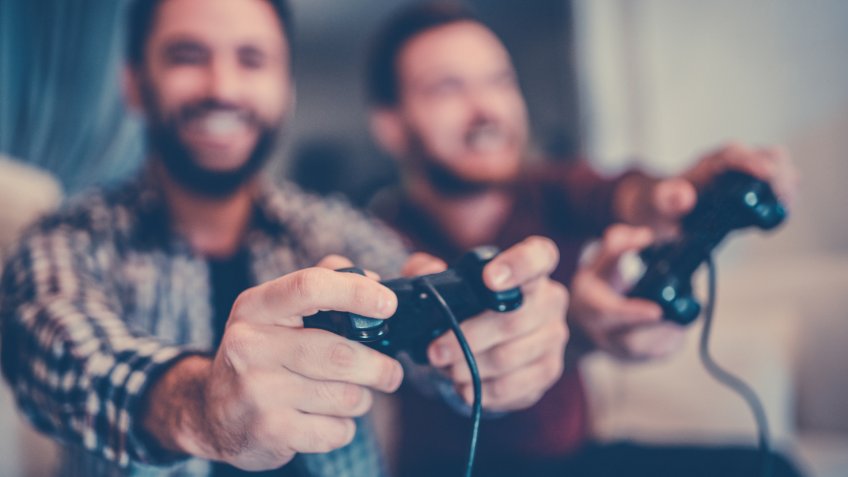 Two Excited Friends Playing Video Games.