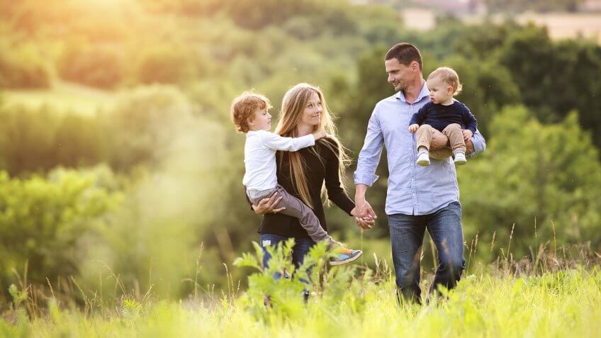 young family spending time together outside