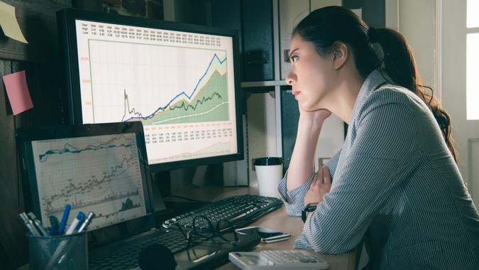 Do You Want the Same Person Handling Your Account Every Day? stock agent watching the computer.