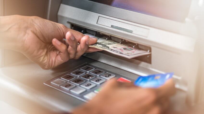 banknotes from ATM machine and credit card