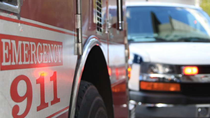 This is an emergency scene including both a fire engine and an ambulance.